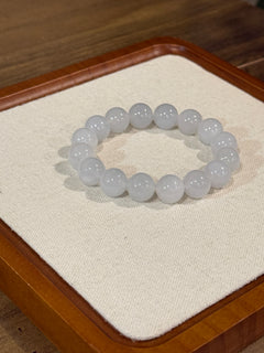Pale lavender jadeite bead bracelet on display tray