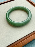Green jadeite bangle, close-up on tray