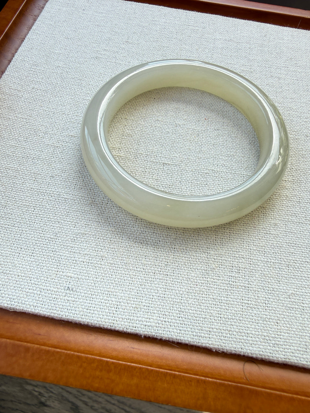 White hetian jade bangle, close-up of polish — CongCong Jade