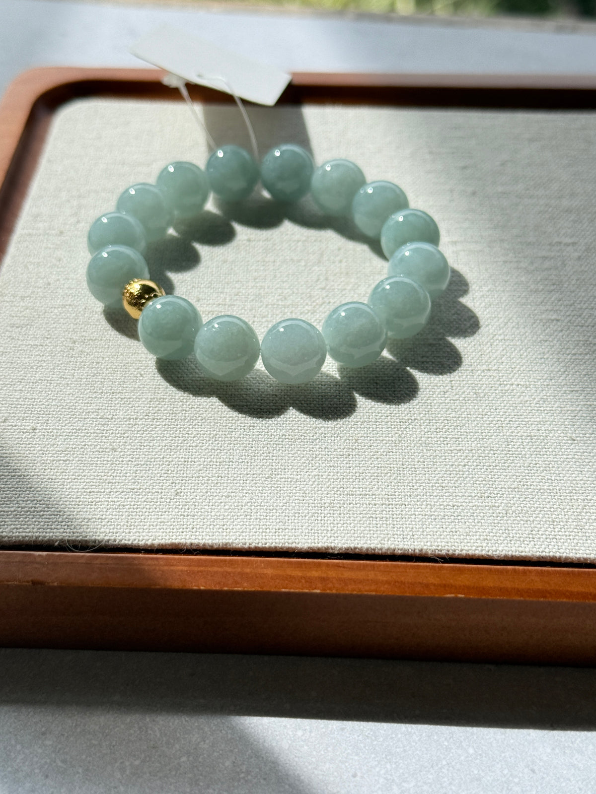 Light green jadeite bead bracelet with price tag — CongCong Jade