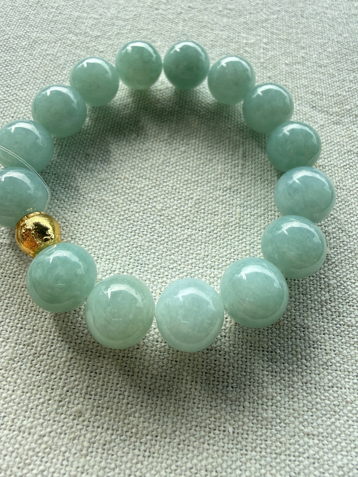 Light green jadeite bead bracelet, close-up of beads — CongCong Jade